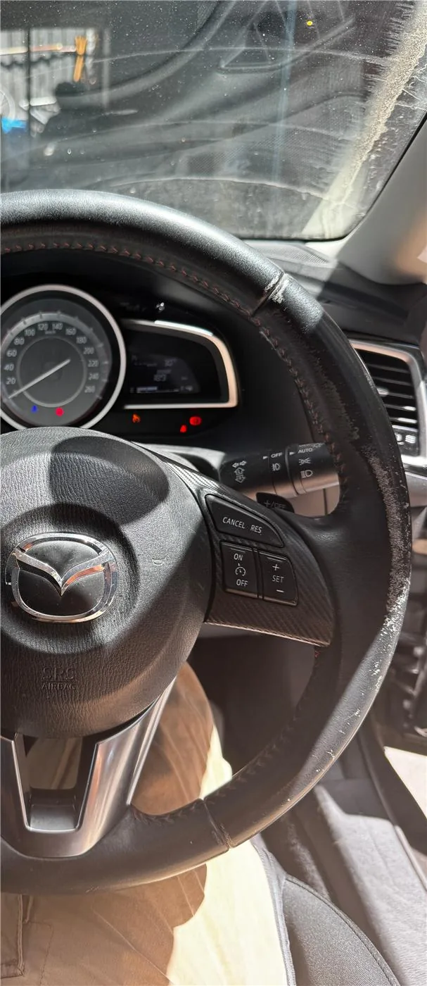 Before: Mazda 3 Steering Wheel Restoration